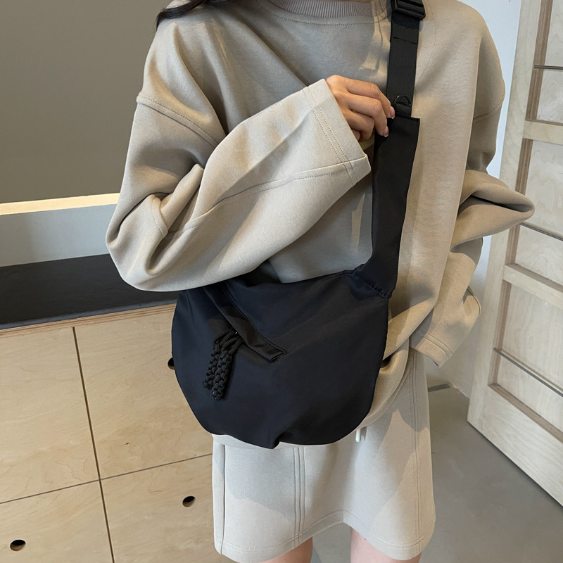 Free shipping designer Casual Versatile Lightweight Canvas Bag New Women Bag Simple Fashion Dumpling Bag Large Capacity Commuter Crossbody Bag