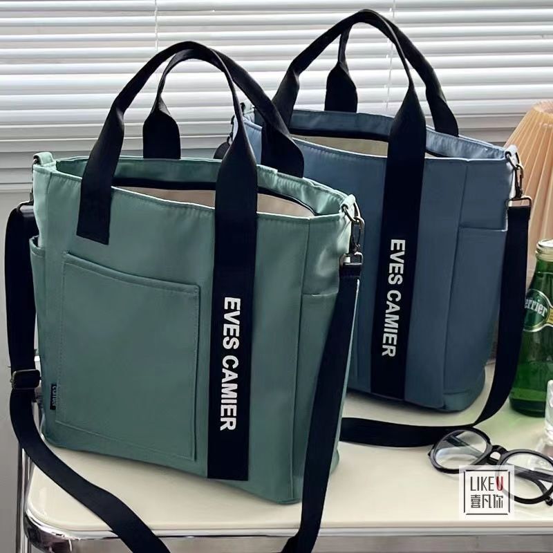 Free Shipping 2025 New Designer Bag Waterproof Canvas Fashion Handbag Simple Multi Functional Shoulder Bag Handheld Leisure High Quality Shopping Bag