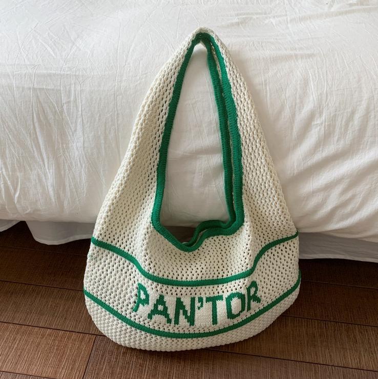Free shipping designer Woven Bag for Women 2025 Summer New Hollow Design Straw Bag for Beach Commuting Knitted Shoulder Underarm Bag