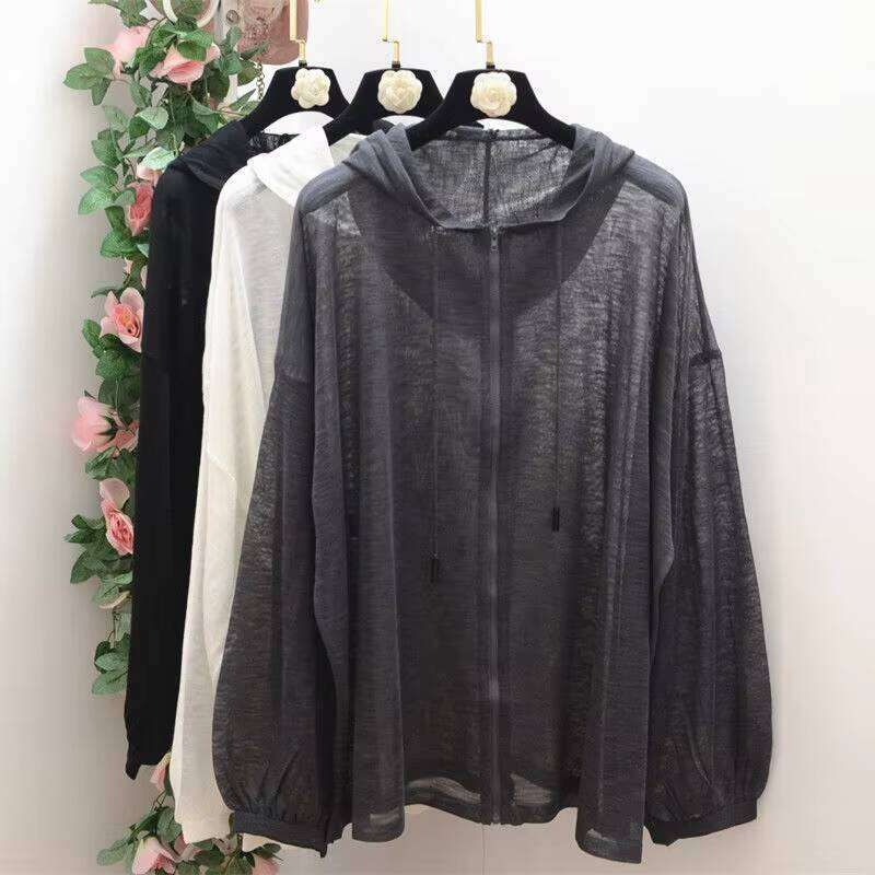 Chic Feminine Apparel Collection Featuring Layered Transparent Coats Contemporary City Chic Outfits