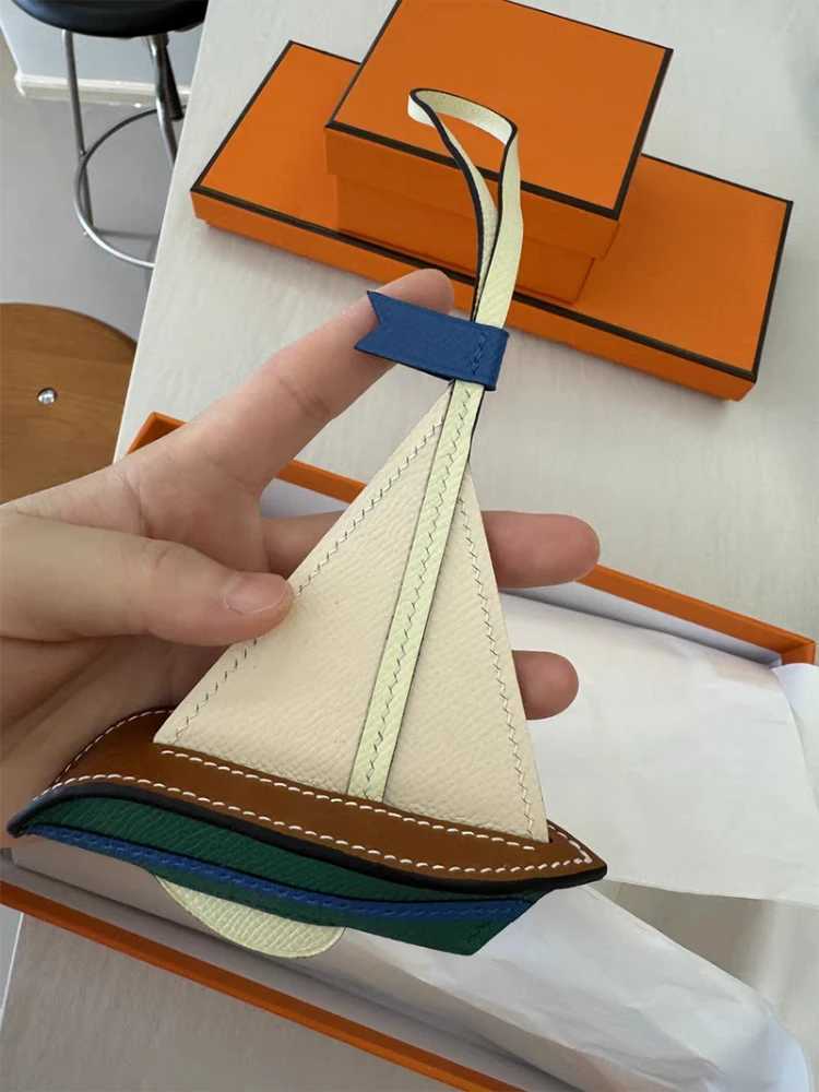 Newly Sailboat Bag Charms Pendant Smooth Sailing Handmade Genuine Cowhide Car Hanging High Quality Key Chain Bags Accessories XJ250619
