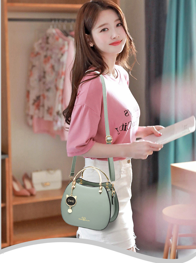 Free Shipping 2025 New Designer Bag High-end Solid Color Cat Pendant Women's Shell Handbag Fashionable And High-quality Shopping Bag