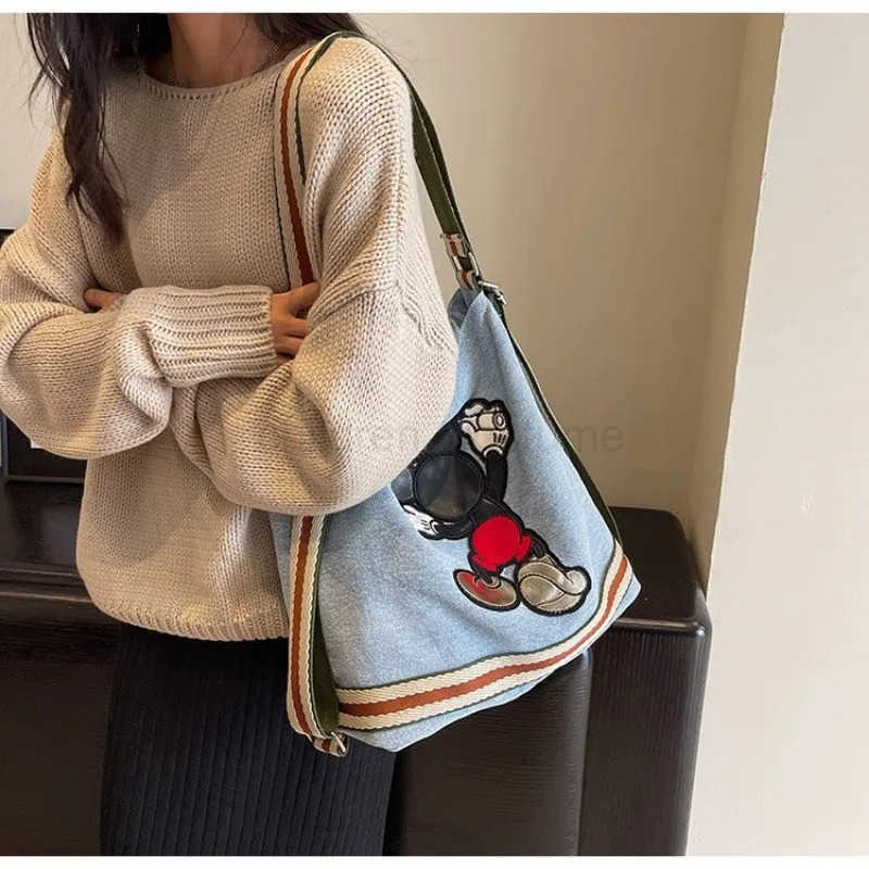 Disney Mickeys new large-capacity womens canvas denim bag college student fashion commuter shoulder bag W250620