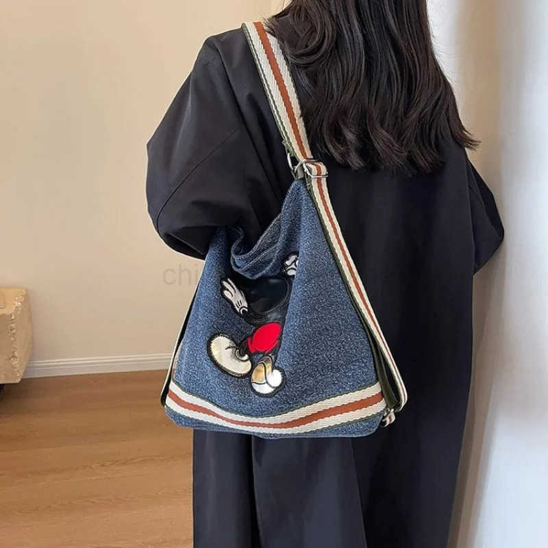 Disney Mickeys new large-capacity womens canvas denim bag college student fashion commuter shoulder bag W250620