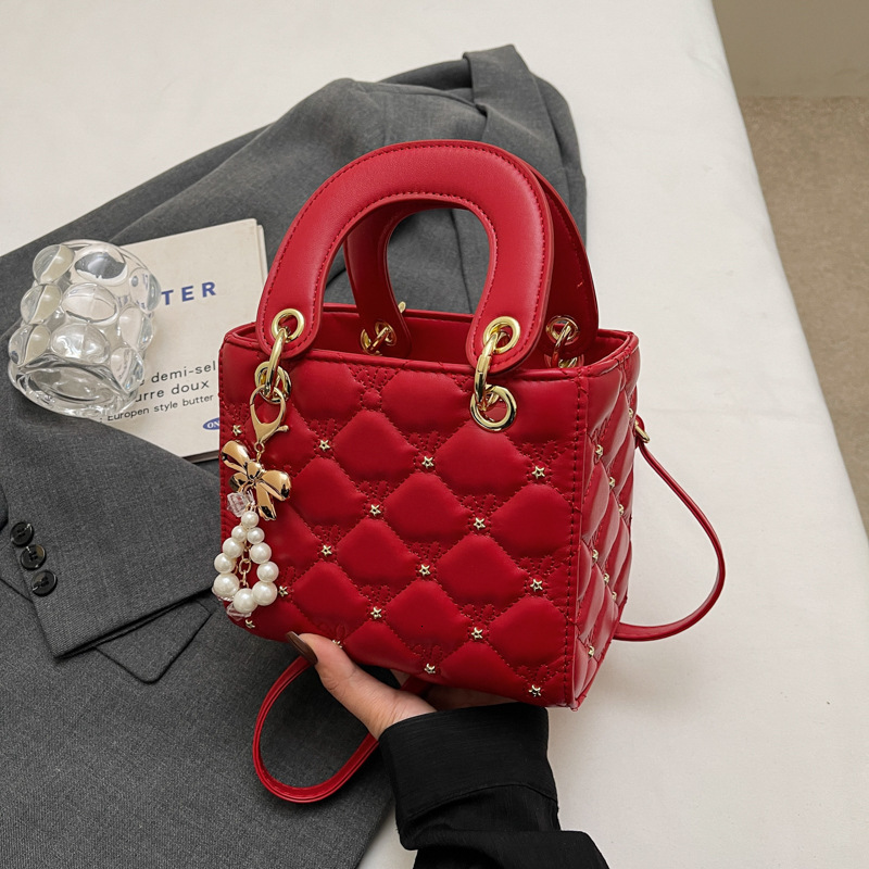 Free Shipping 2025 New Designer Bag Casual Boutique Shopping Bag High-end Solid Color Lightweight Pearl Pendant Women's Handbag