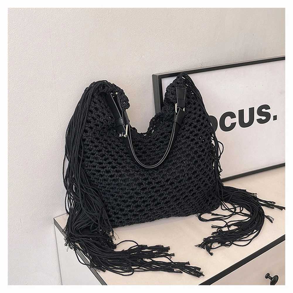 Womens Spring 2025 New Simple Hollow Woven Bohemian Tassels Tote Bag Casual Beach Vacation Style Single Shoulder Beach Bag XJ250620