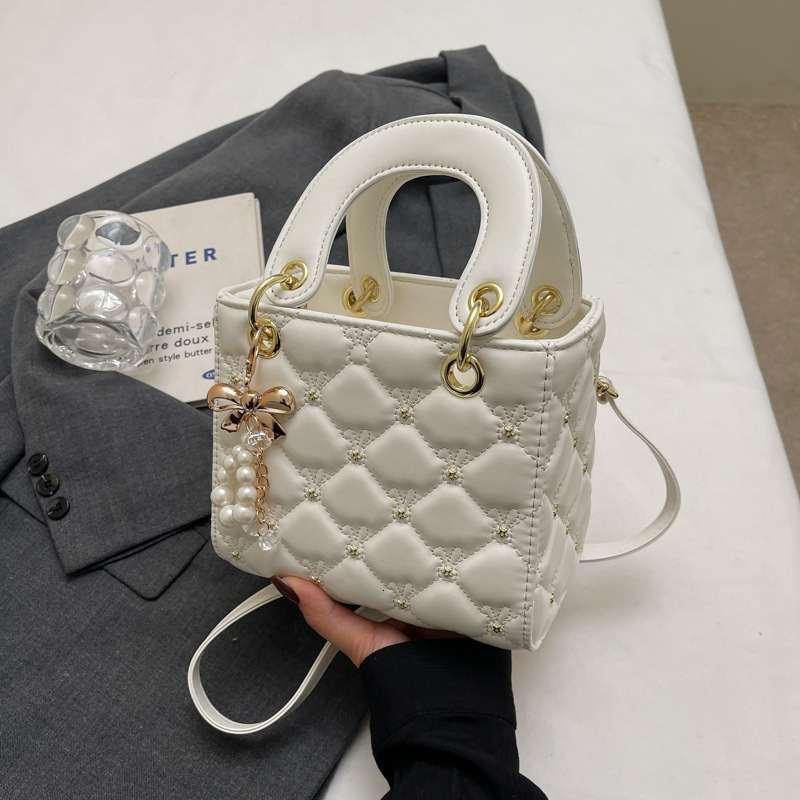 Free Shipping 2025 New Designer Bag Casual Boutique Shopping Bag High-end Solid Color Lightweight Pearl Pendant Women's Handbag