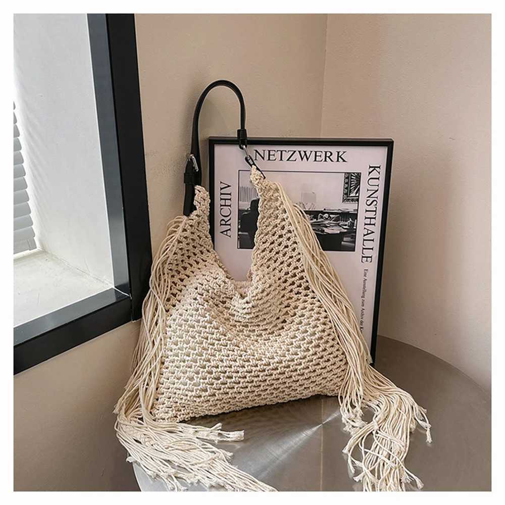 Womens Spring 2025 New Simple Hollow Woven Bohemian Tassels Tote Bag Casual Beach Vacation Style Single Shoulder Beach Bag XJ250620