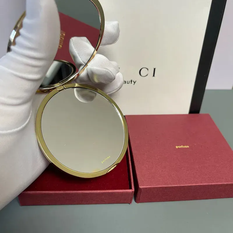 Designer holding makeup mirror New Gold Travel Makeup Mirror Compact Stainless Steel Metal Pocket Vanity Mirror 2 Sided Women Portable Folding Mirror Gift