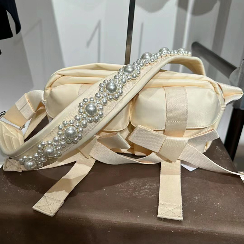 Free shipping designer bag 2023 Autumn New Casual Trendy Cool Sweet Jubilee Hot Girl Bag Pearl Bowknot Shoulder Bag Crossbody Bag Multi-pocket Women