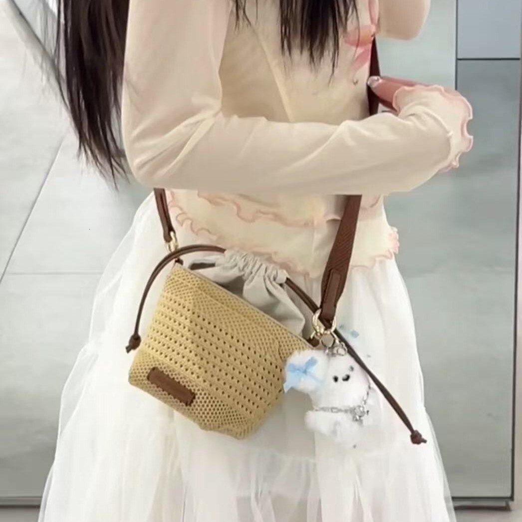 free shipping designer 2025 luxury New Hollow Woven Bag for Women, Light Luxury Niche High-end Vacation Beach Bag with Drawstring Crossbody Bucket Bag