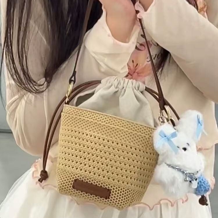 free shipping designer 2025 luxury New Hollow Woven Bag for Women, Light Luxury Niche High-end Vacation Beach Bag with Drawstring Crossbody Bucket Bag