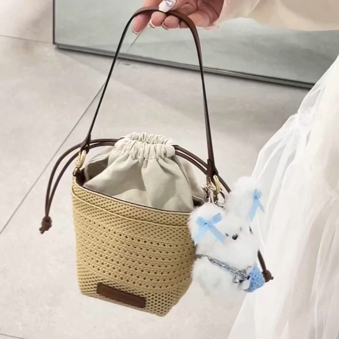 free shipping designer 2025 luxury New Hollow Woven Bag for Women, Light Luxury Niche High-end Vacation Beach Bag with Drawstring Crossbody Bucket Bag