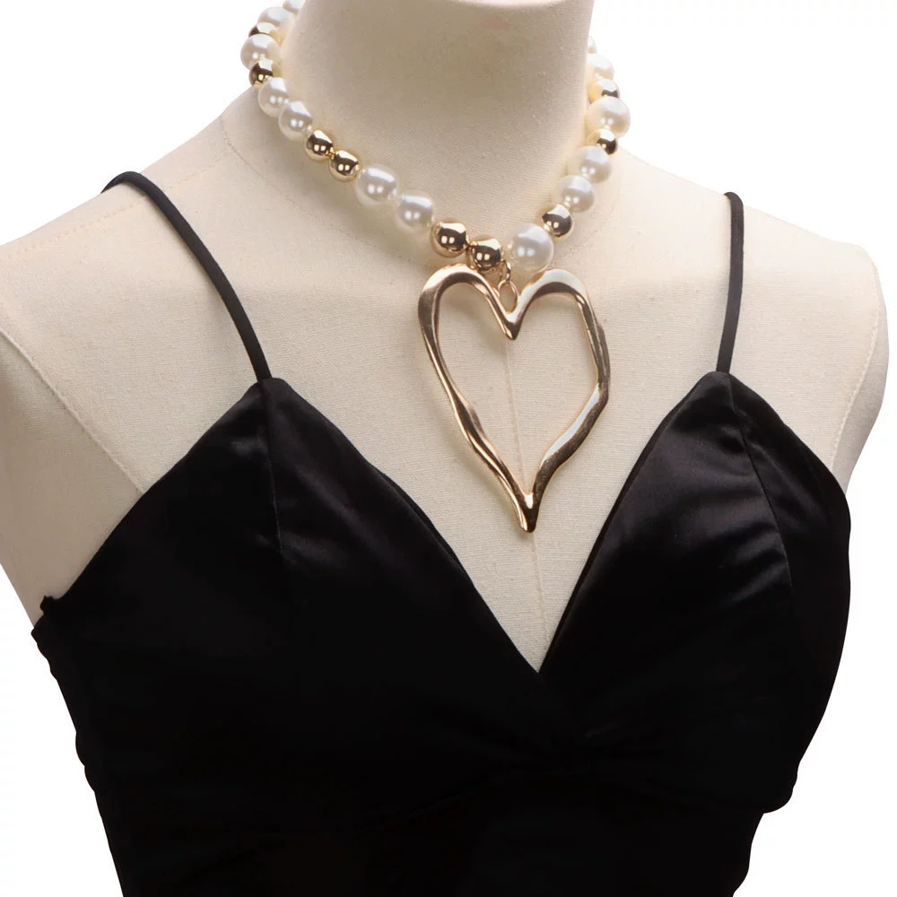Chic Earrings Set: Bold Lava Heart Pendants Complementing Delicate Pearls