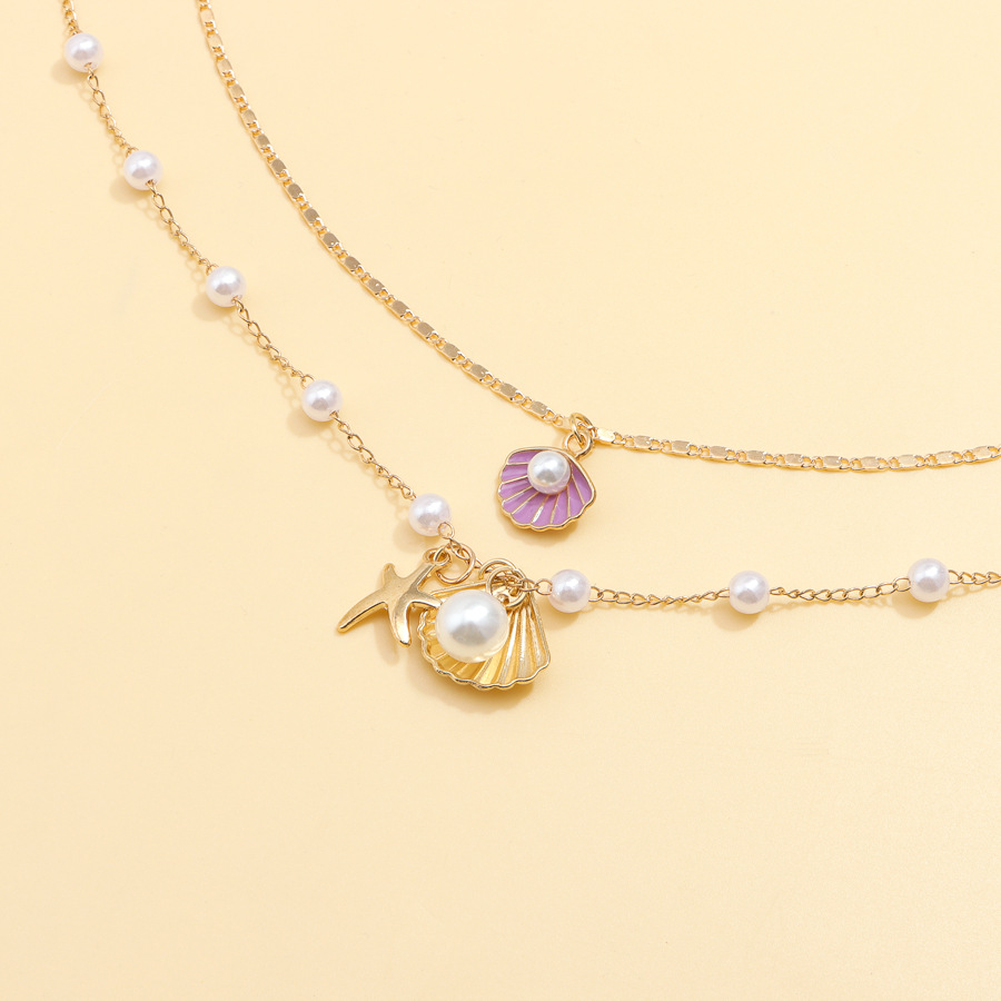 Luxurious Beach-Themed Pearl Necklace Ensemble - Unique Combining Realistic Seashell Molds And Gleaming Gold Finishes