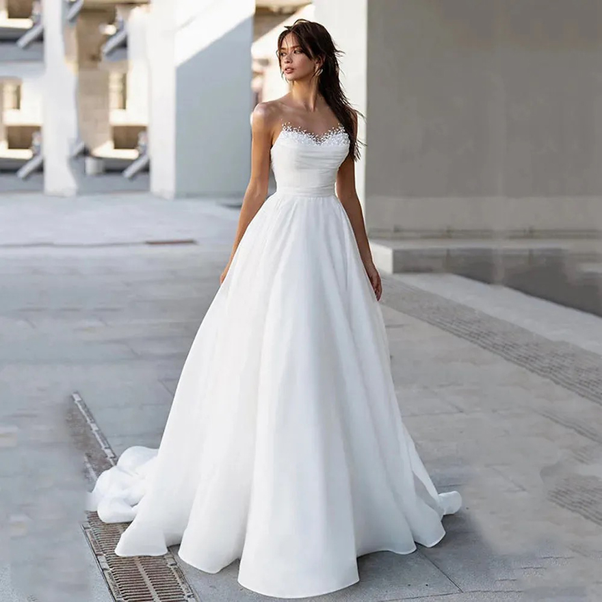 New White A Line Wedding Dress 2025 Sheer Neck Sleeveless Pearls Beads Beach Bride Gowns Vestidos De Novias Robe De Mariage
