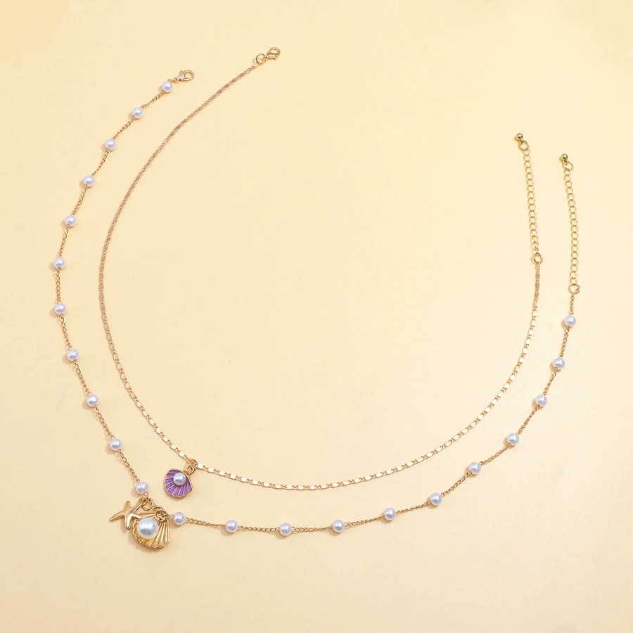 Luxurious Beach-Themed Pearl Necklace Ensemble - Unique Combining Realistic Seashell Molds And Gleaming Gold Finishes