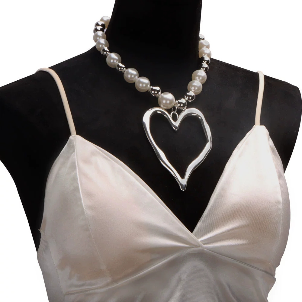 Chic Earrings Set: Bold Lava Heart Pendants Complementing Delicate Pearls