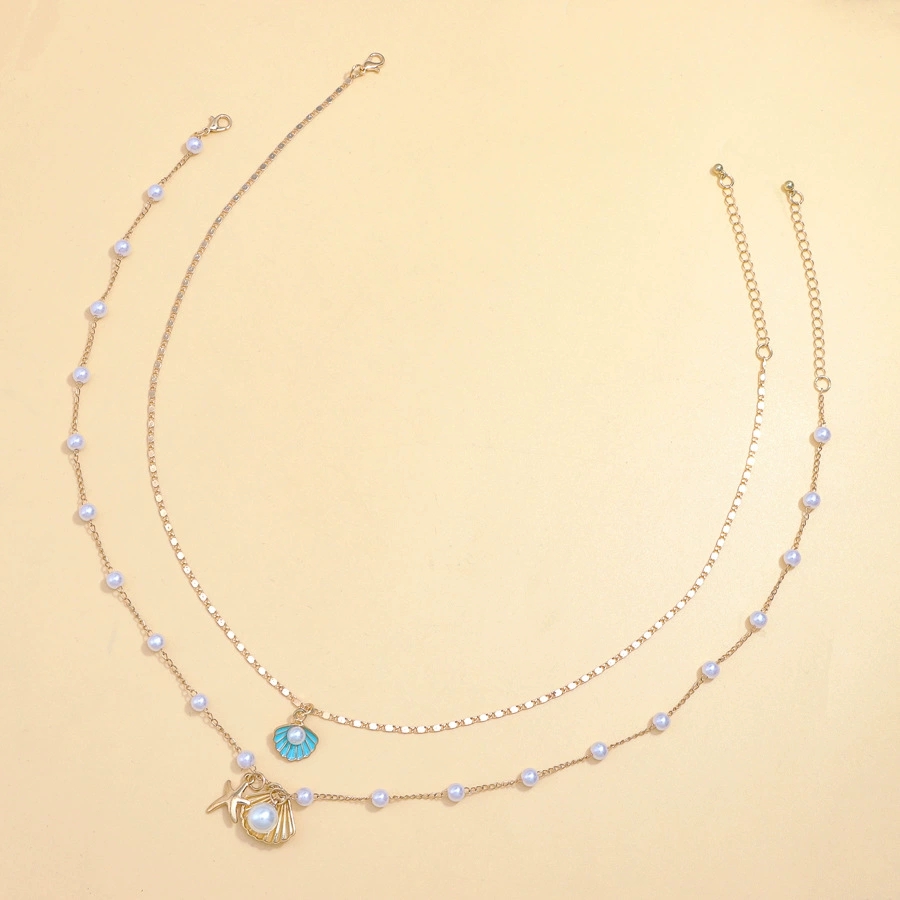 Luxurious Beach-Themed Pearl Necklace Ensemble - Unique Combining Realistic Seashell Molds And Gleaming Gold Finishes