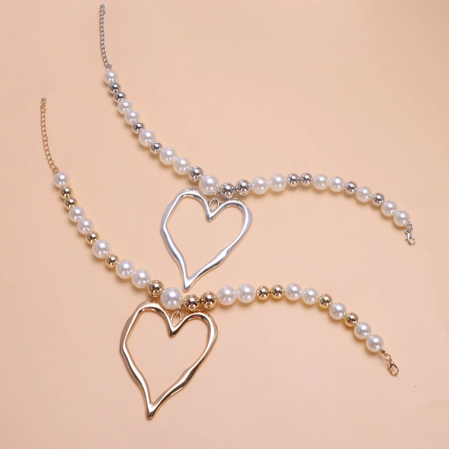 Chic Earrings Set: Bold Lava Heart Pendants Complementing Delicate Pearls