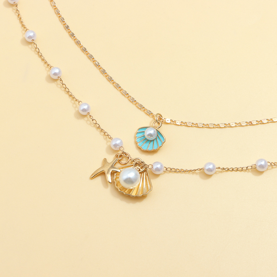 Luxurious Beach-Themed Pearl Necklace Ensemble - Unique Combining Realistic Seashell Molds And Gleaming Gold Finishes