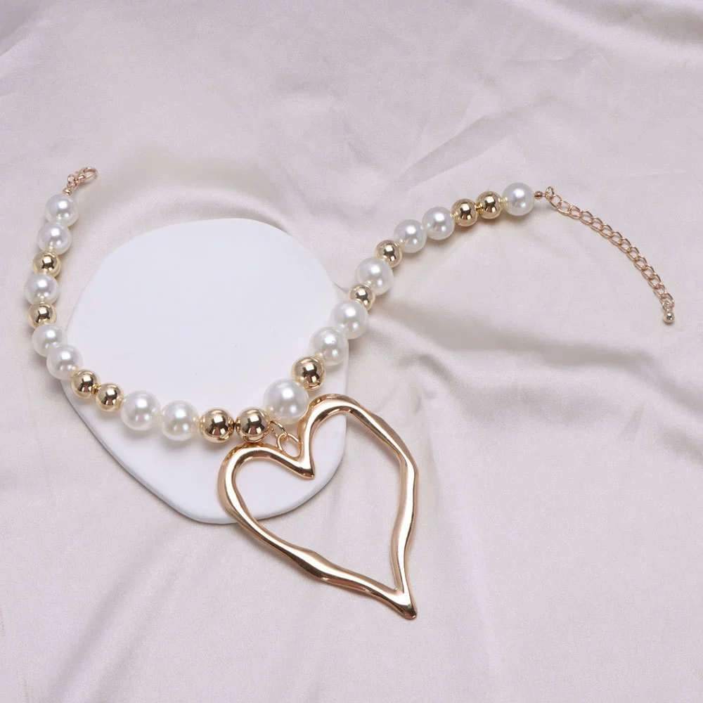 Chic Earrings Set: Bold Lava Heart Pendants Complementing Delicate Pearls