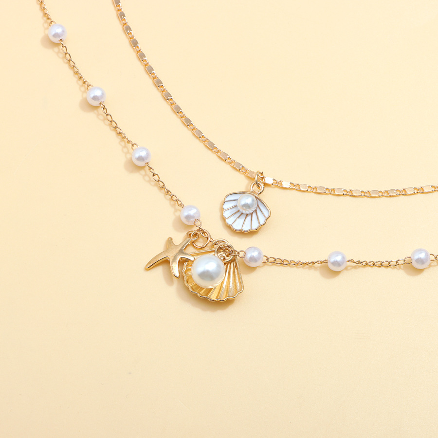 Luxurious Beach-Themed Pearl Necklace Ensemble - Unique Combining Realistic Seashell Molds And Gleaming Gold Finishes
