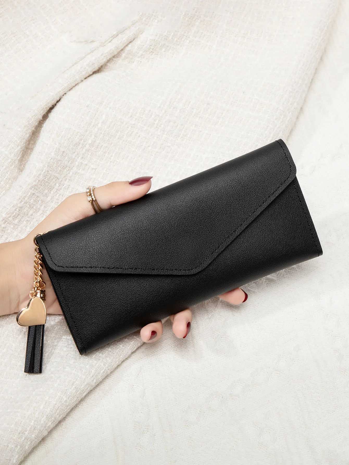 Simple and stylish three-fold womens wallet PU leather large capacity lg wallet tassel pendant solid color wallet card bagXJ250624