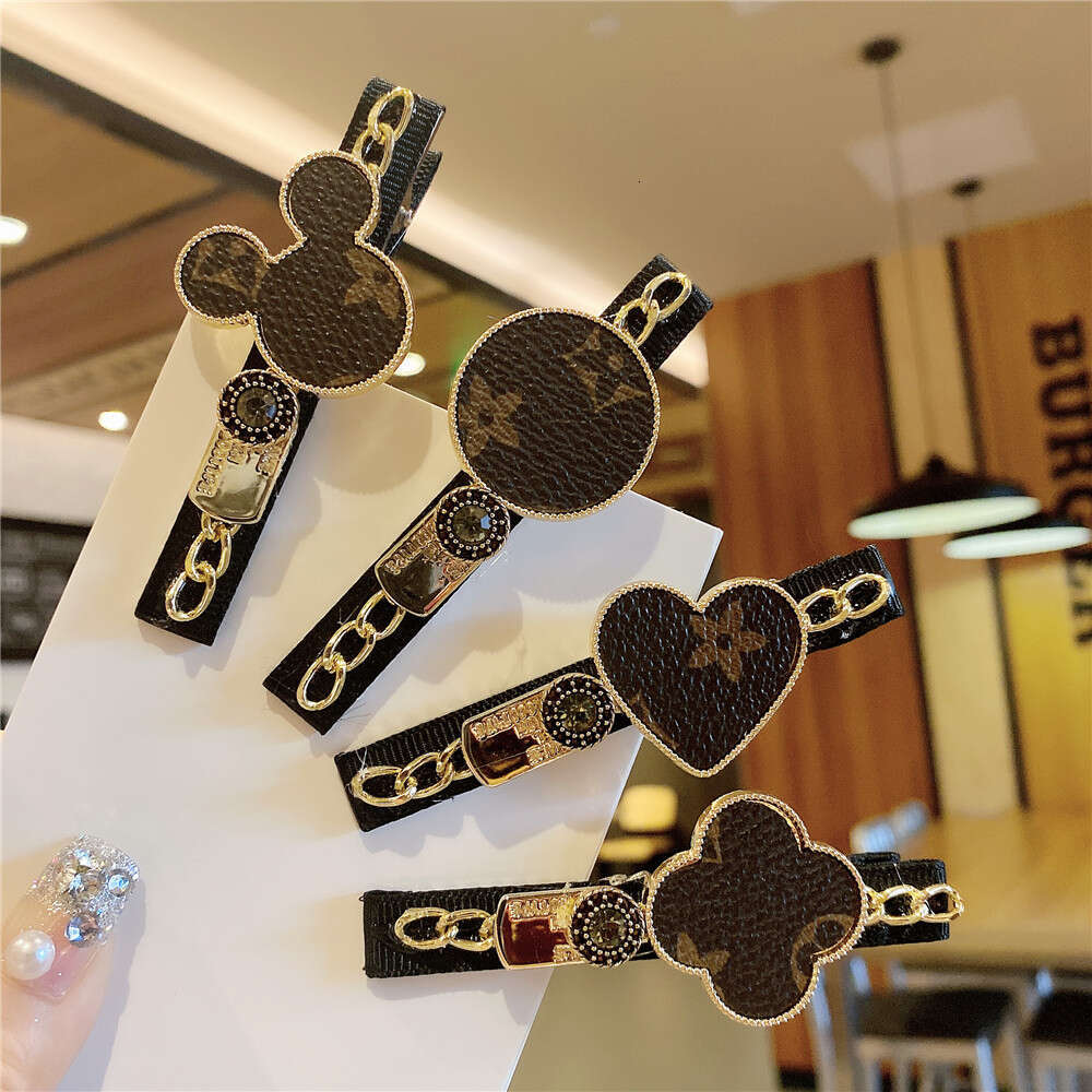 DHcollections Korean New Hair Cartoon Chain Metal Side Printed Leather Bangs Clip Kuaishou Same Style