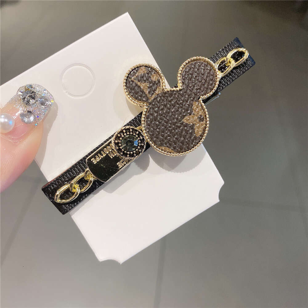 DHcollections Korean New Hair Cartoon Chain Metal Side Printed Leather Bangs Clip Kuaishou Same Style