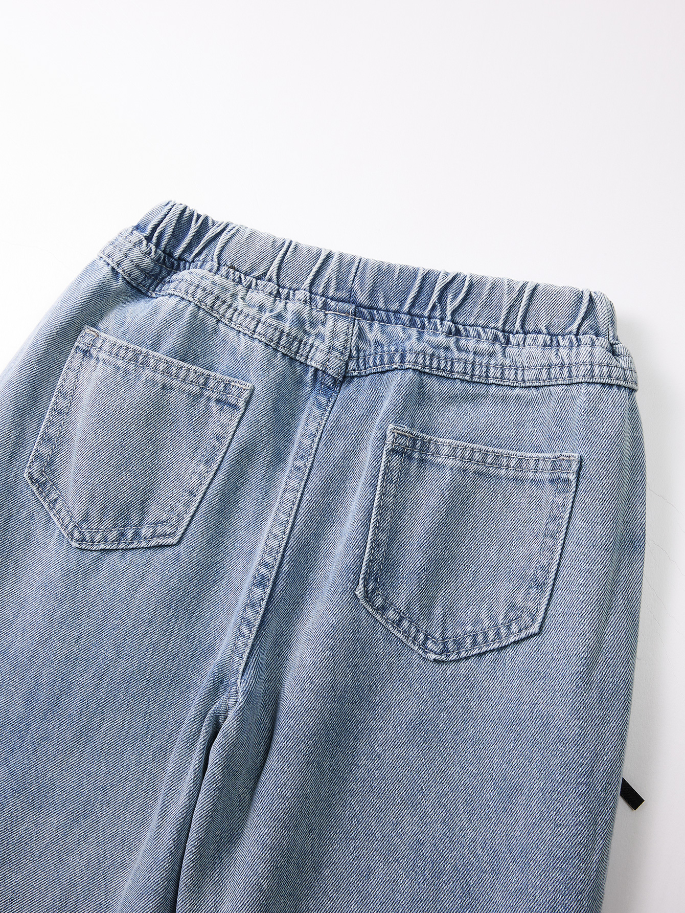Cute Kid's Lightweight Indigo Trousers Complemented by an Elegant Black Knot Embellishment