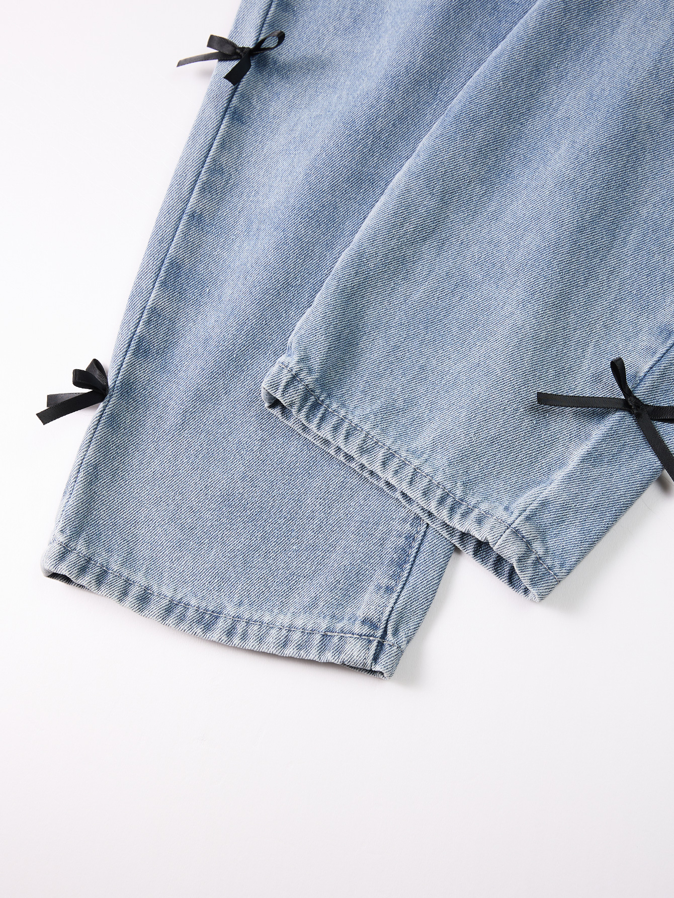 Cute Kid's Lightweight Indigo Trousers Complemented by an Elegant Black Knot Embellishment