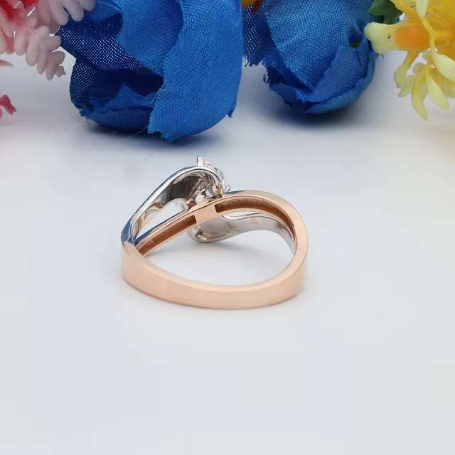 Sophisticated Unisex Designer Gemstone Jewelry Piece Featuring a Versatile Oval-Shaped Stone Embedded in Robust Yellowish-Pink Alloy