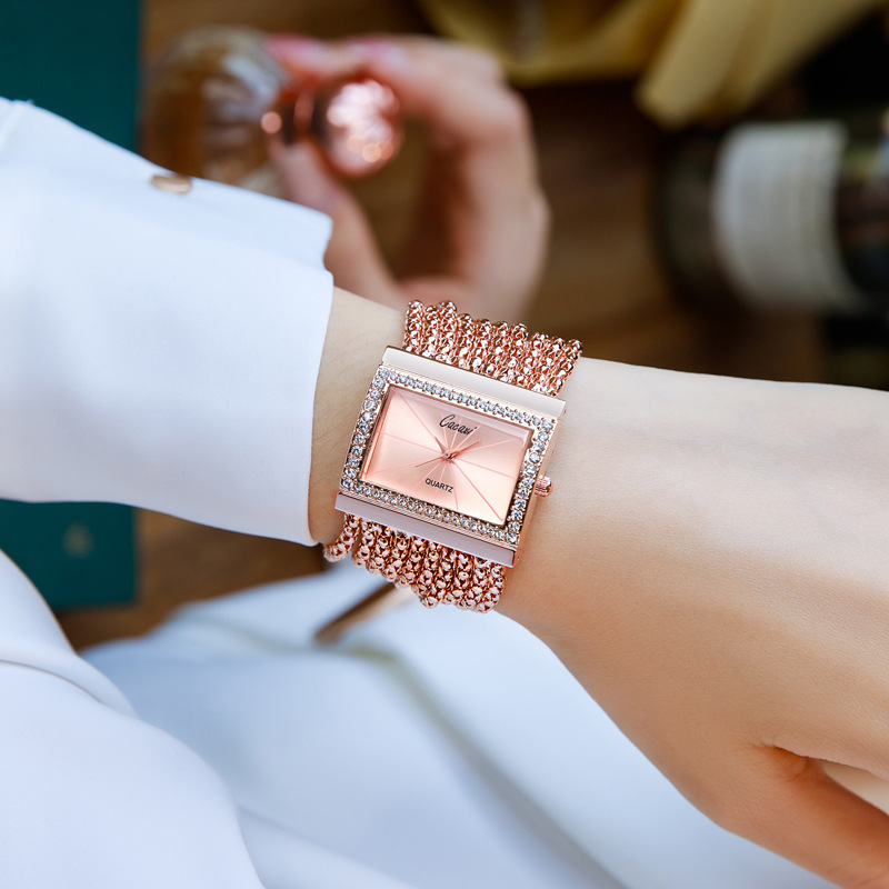 Sophisticated Ladys Jewelry-Watch Hybrid Featuring Shimmering Stones & Sleek Design