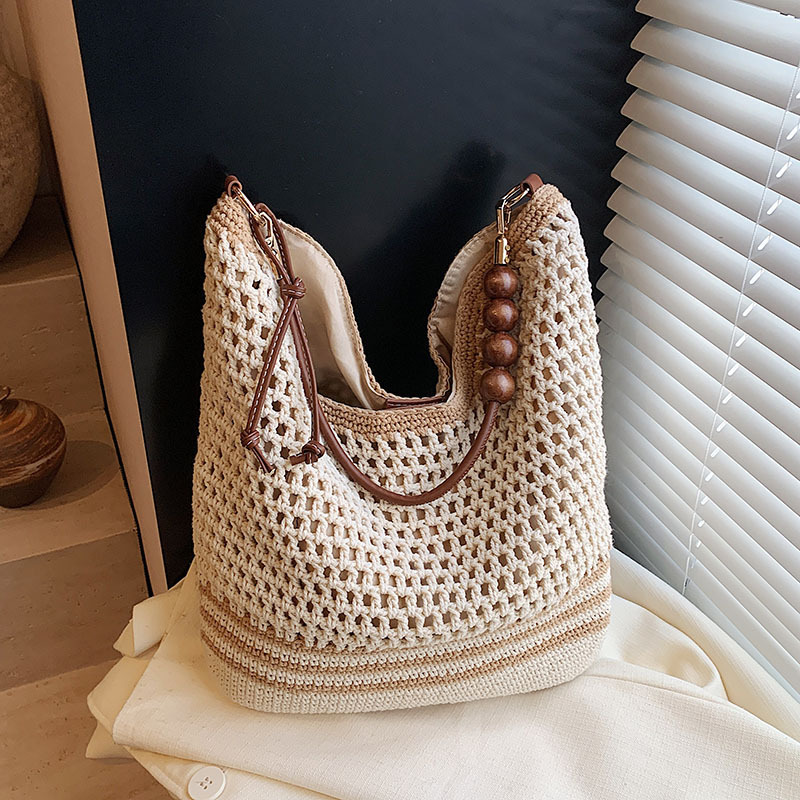 designer bag new Women's Hollow Knitted Handbag for Beach Vacation A Large-capacity Shoulder and Underarm Bag Woven on the Beach