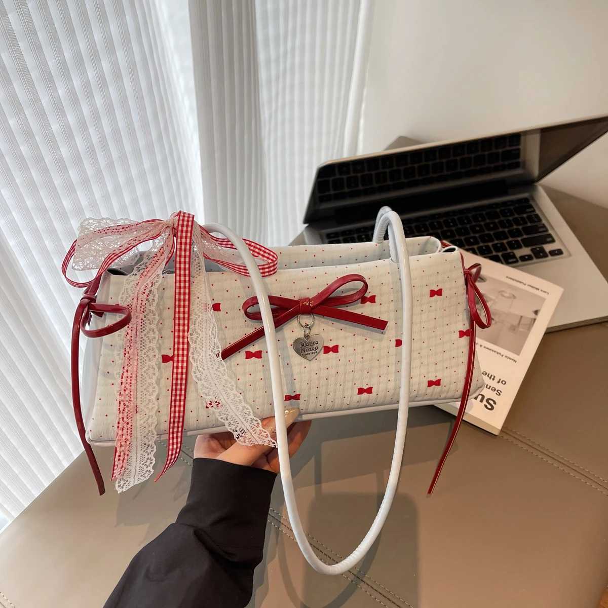 Mini ladies handbags handbag from China. Minority design shoulder bag new commuter temperament bow advanced texture shoulder bag. XJ250627