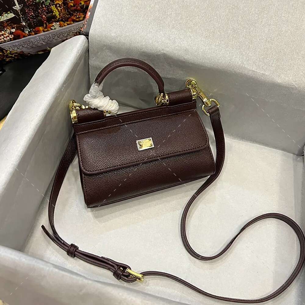 Sophisticated Ladies' Fashion Accessory: Premium Quality Calf Leather Crossbody Pouch by Renowned Brand