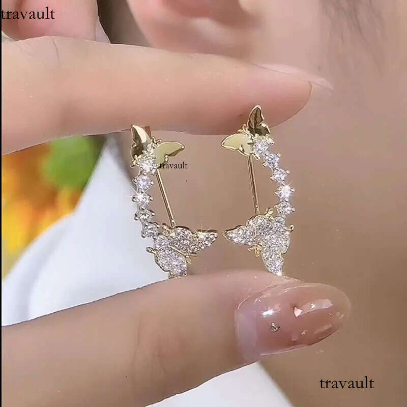 DHcollection Bright Earrings Made of Pure Sier Double Butterfly Cube Zircon for Women