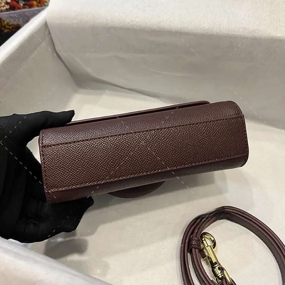 Sophisticated Ladies' Fashion Accessory: Premium Quality Calf Leather Crossbody Pouch by Renowned Brand