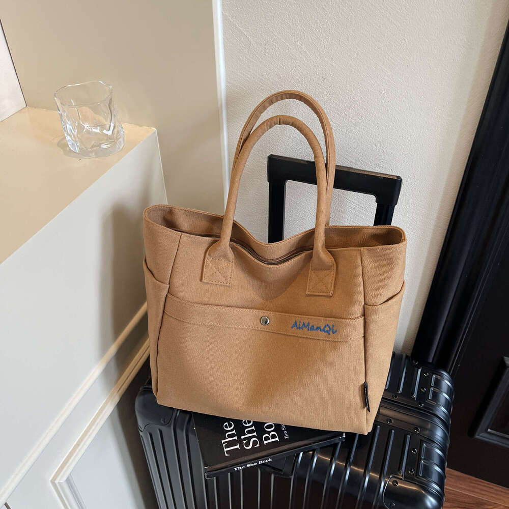designer bag Luxury bag Large Capacity Commuter Canvas New Fashion Versatile Korean Design Handheld Shoulder Tote Bag