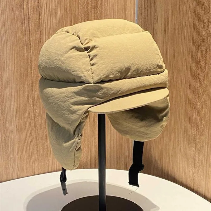 Autumn and Winter Solid Color Down Padded Lei Feng Cap for Men and Women Warmth Cycling Ear Protection Flying Bomber Hats Gorras 250930