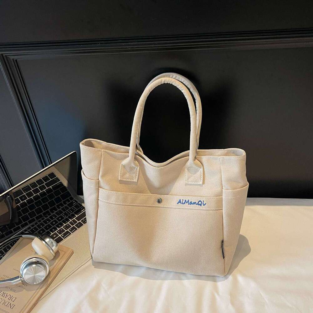 designer bag Luxury bag Large Capacity Commuter Canvas New Fashion Versatile Korean Design Handheld Shoulder Tote Bag