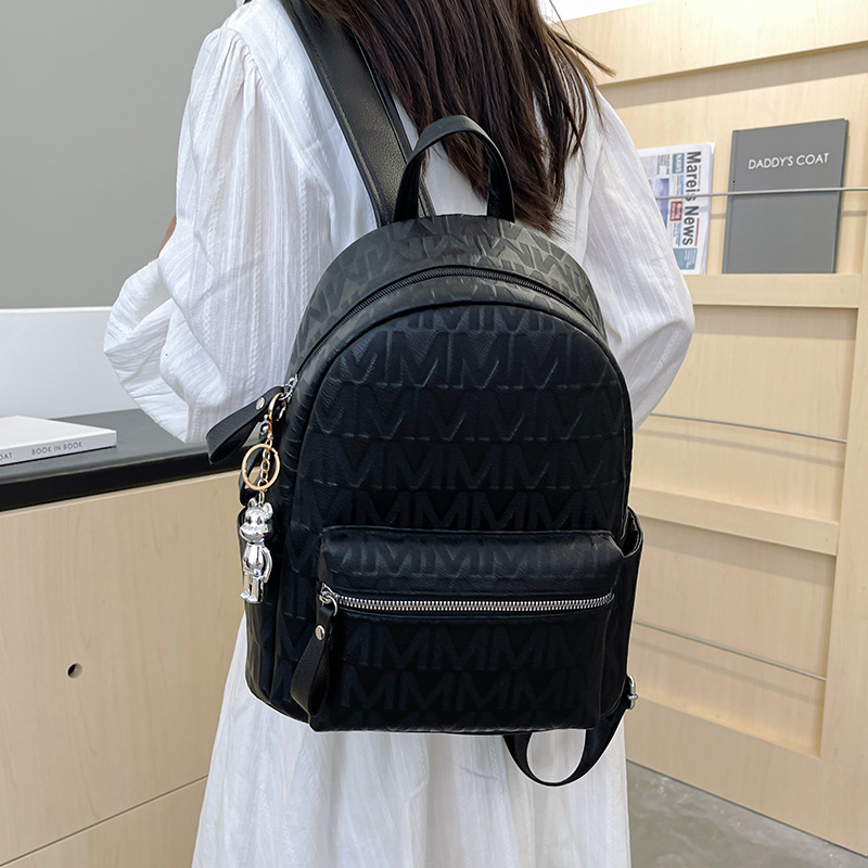 Luxury Bag Designer Bag 2025 New Women's Backpack British Style Embossed Letter Backpack Hong Kong Style Commuter Soft Leather Texture College St