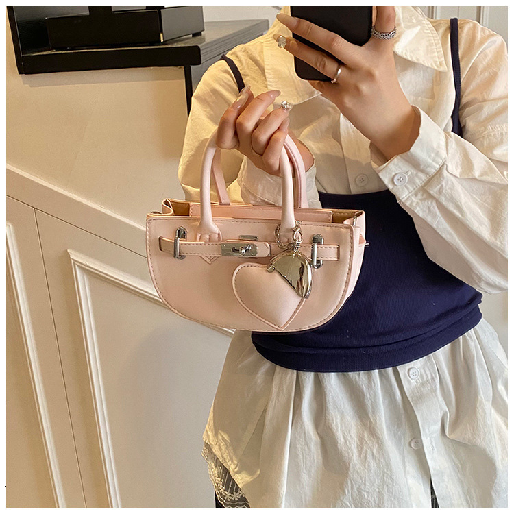 Ladies' fashionable solid color handbag autumn and winter new love pendant trendy luxury bag versatile niche style designer bag