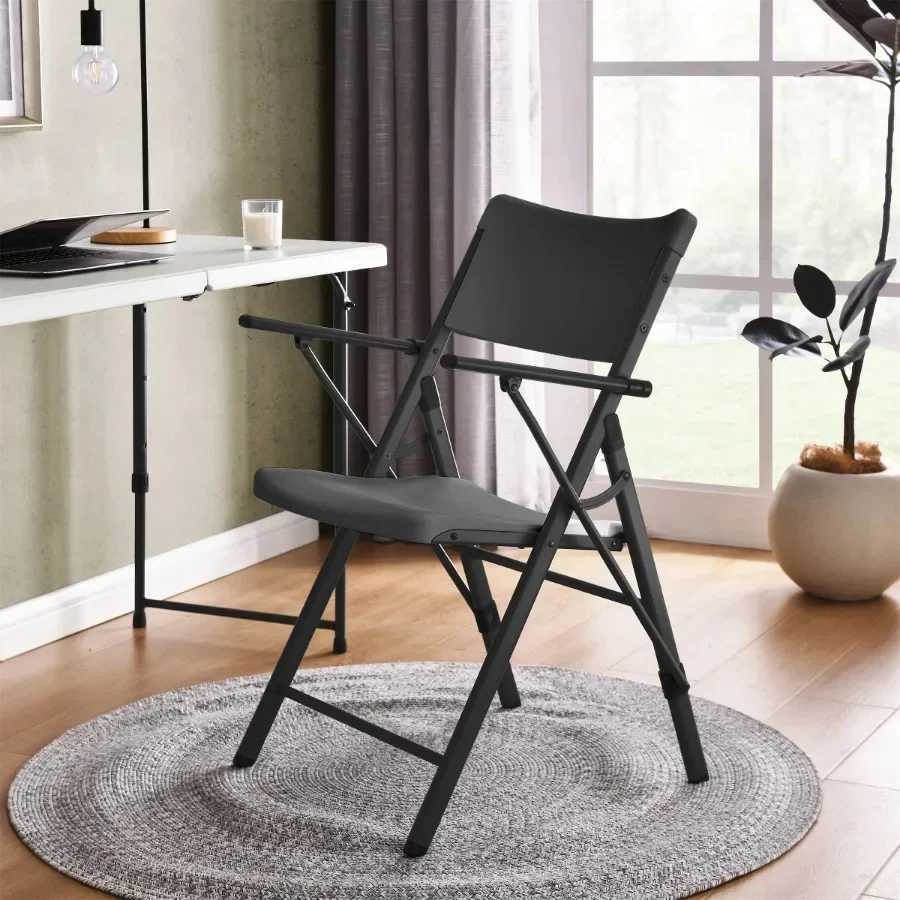 2pack of black commercial plastic folding chairs with armrests featuring a lightweight easytoclean design and durable cover J250930