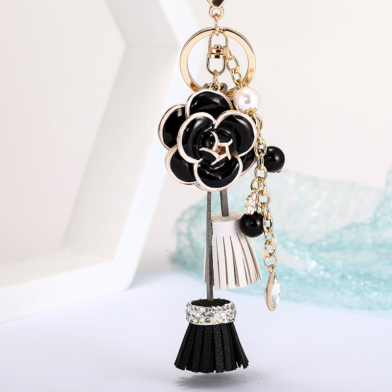keychain Korean Version Light Luxury Pearl Chain Bag Pendant Camellia Leather Tassel Ornament Car Keychain Accessory bag charms Z260130
