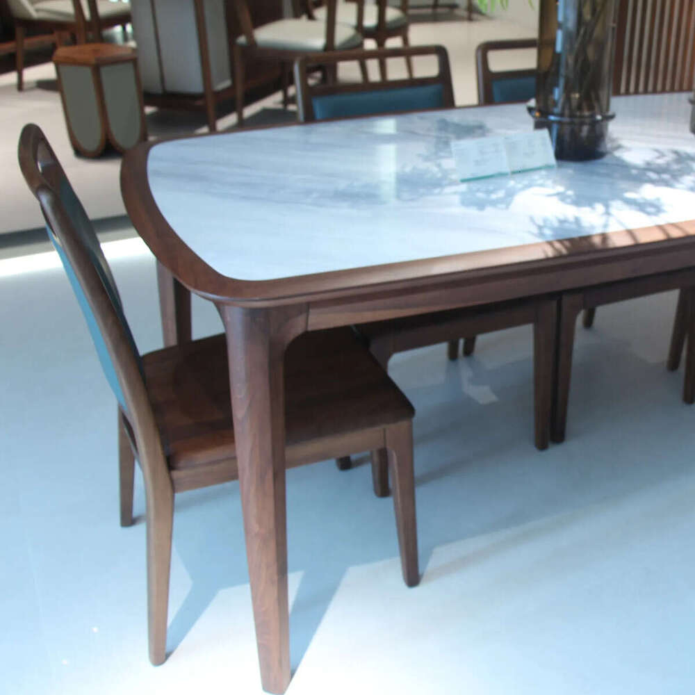 Zhong zhixin High-end design 2025 New The modern dining table is meticulously crafted from solid wood and marble