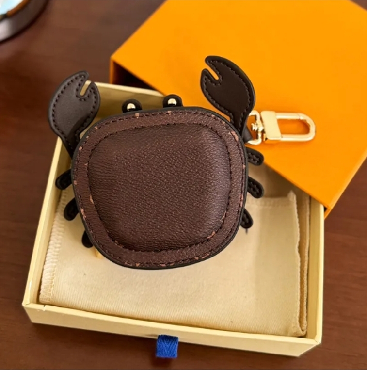 Classic LoisVuton Keychain Bluetooth Wireless Headphone Case Crab Pendant Pouch Keychain Pendant High-End Leather Coin Purse Cute Mini Edition