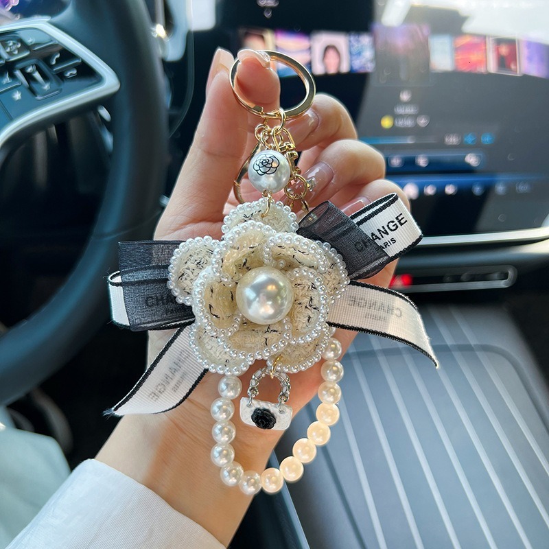 Korean Version Pearl Camellia Car with Bowknot Bag Pendant Creative Fashion Keychain for Women
