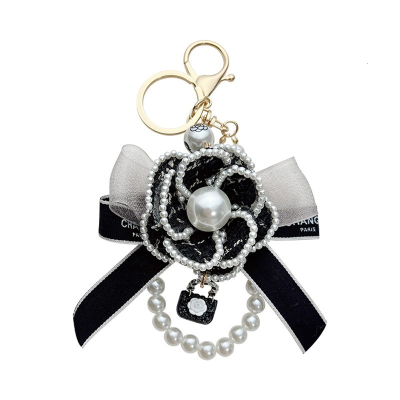 Korean Version Pearl Camellia Car with Bowknot Bag Pendant Creative Fashion Keychain for Women